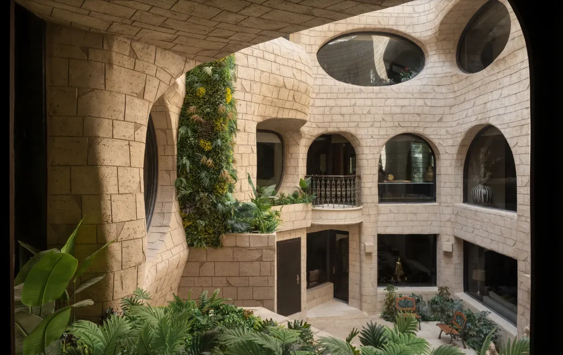 Atrium courtyard view with planting and rounded openings